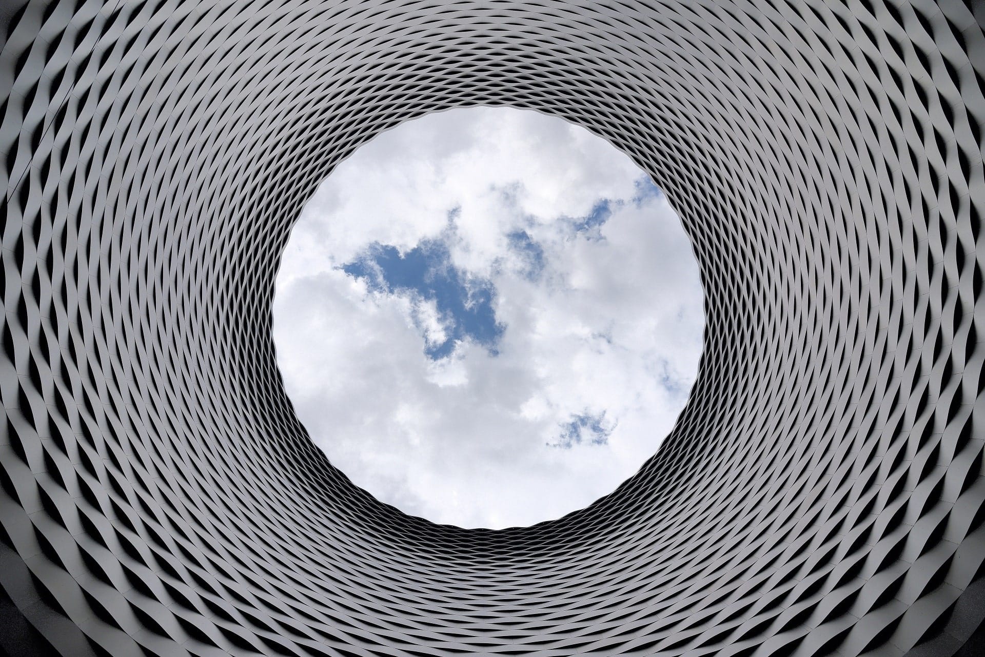 Cloud Services in San Jose, CA--represented by a view of clouds through a cylindrical sculpture. | ExoIS
